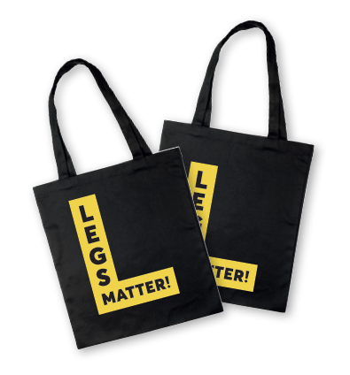 Black Legs Matter tote bags with yellow logos